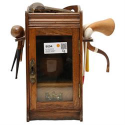 Small Edwardian oak smoker's cabinet with tobacco jar, Meerschaum pipe, three clay pipes, ...
