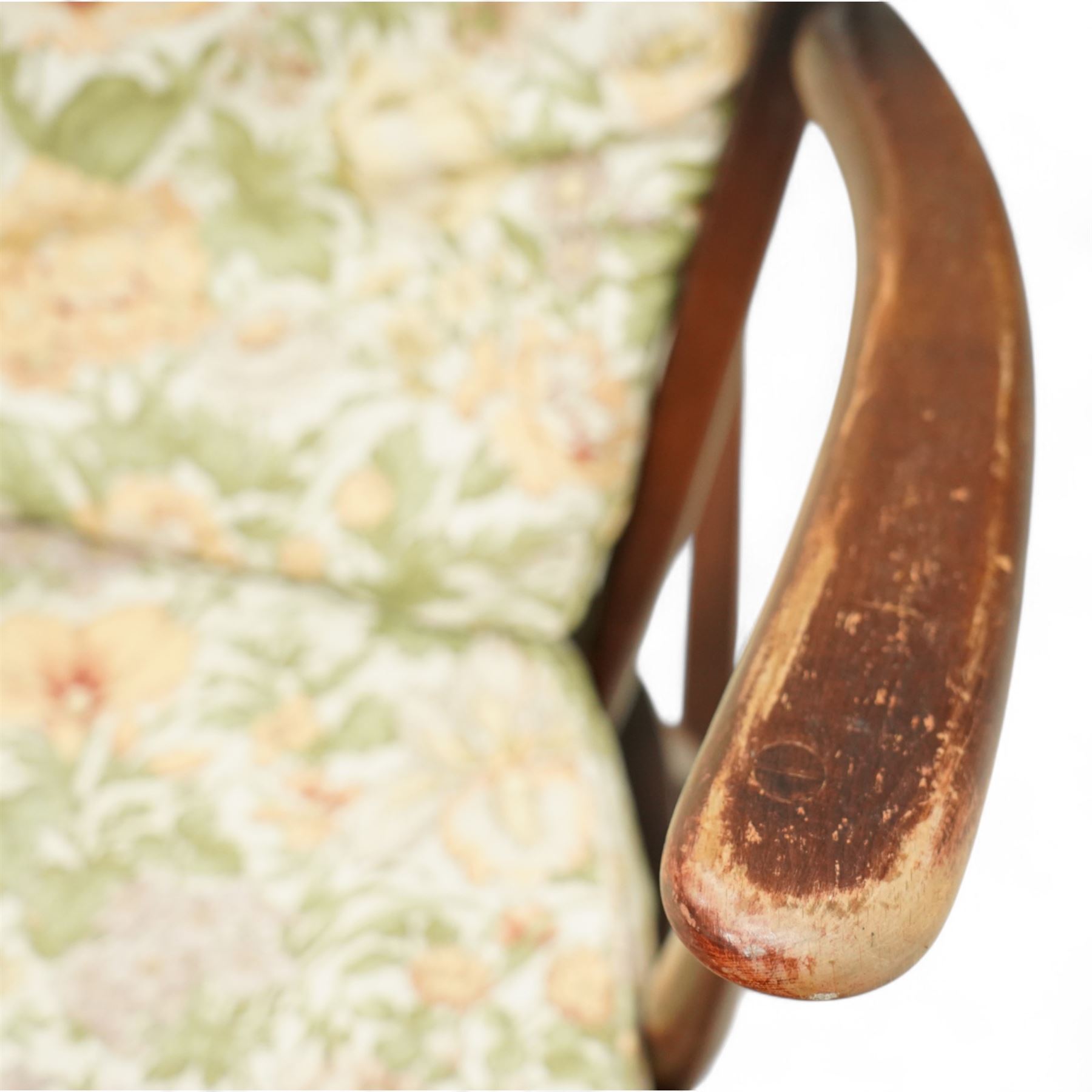 Ercol - Mid-20th century ‘Fleur-de-Lis’ rocking chair, elm and beech frame with curved arms, pierced back crest and stick supports, floral upholstered seat and back cushions, on curved rockers