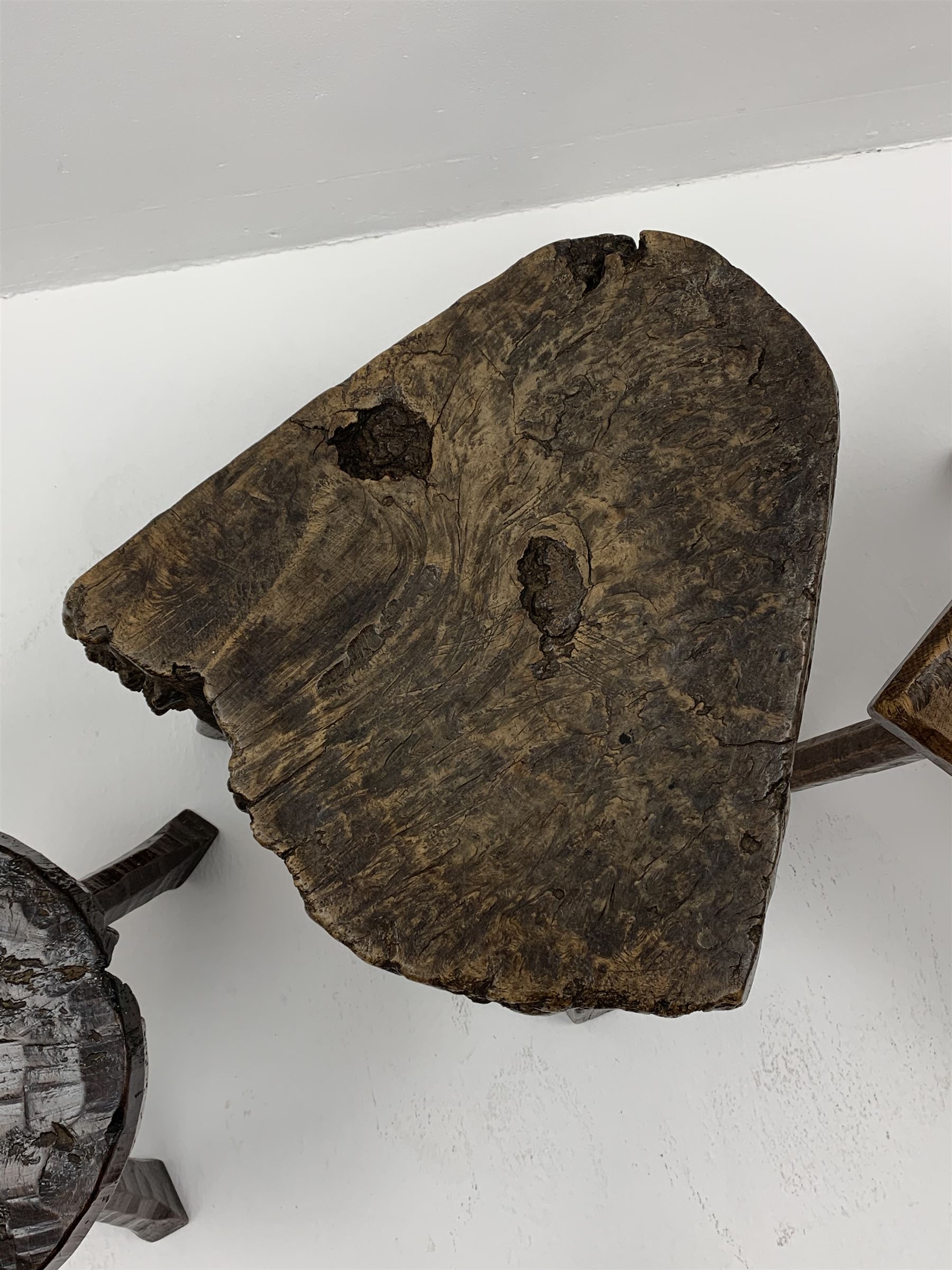 Collection of three mid 20th century stools by Jack Grimble of Cromer - rectangular tooled oak seat on four splayed supports (38cm x 31cm, H35cm), circular tooled burr oak seat on three supports (D29cm, H35cm), shaped burr top on three supports (L44cm, H45cm), each signed underneath