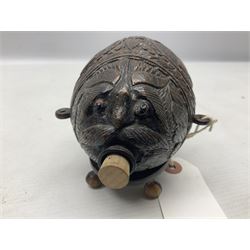 19th century bug bear flask carved with Balkan figures, a wolf and leafage with glass eyes, L14cm on stand 