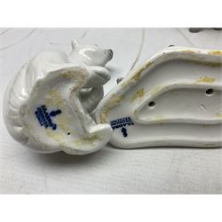 Seven Lladro figures, comprising Playful Puppy no 9135, Platero and Marcelino/Boy Hugging Donkey no 1181, Mini Seal Family no 5318, Attentive Polar Bear no 1207, Seated Polar Bear no1209, Eskimo Boy with Pet no 5238 and Girl with Geese no 1035, together with Nao goose