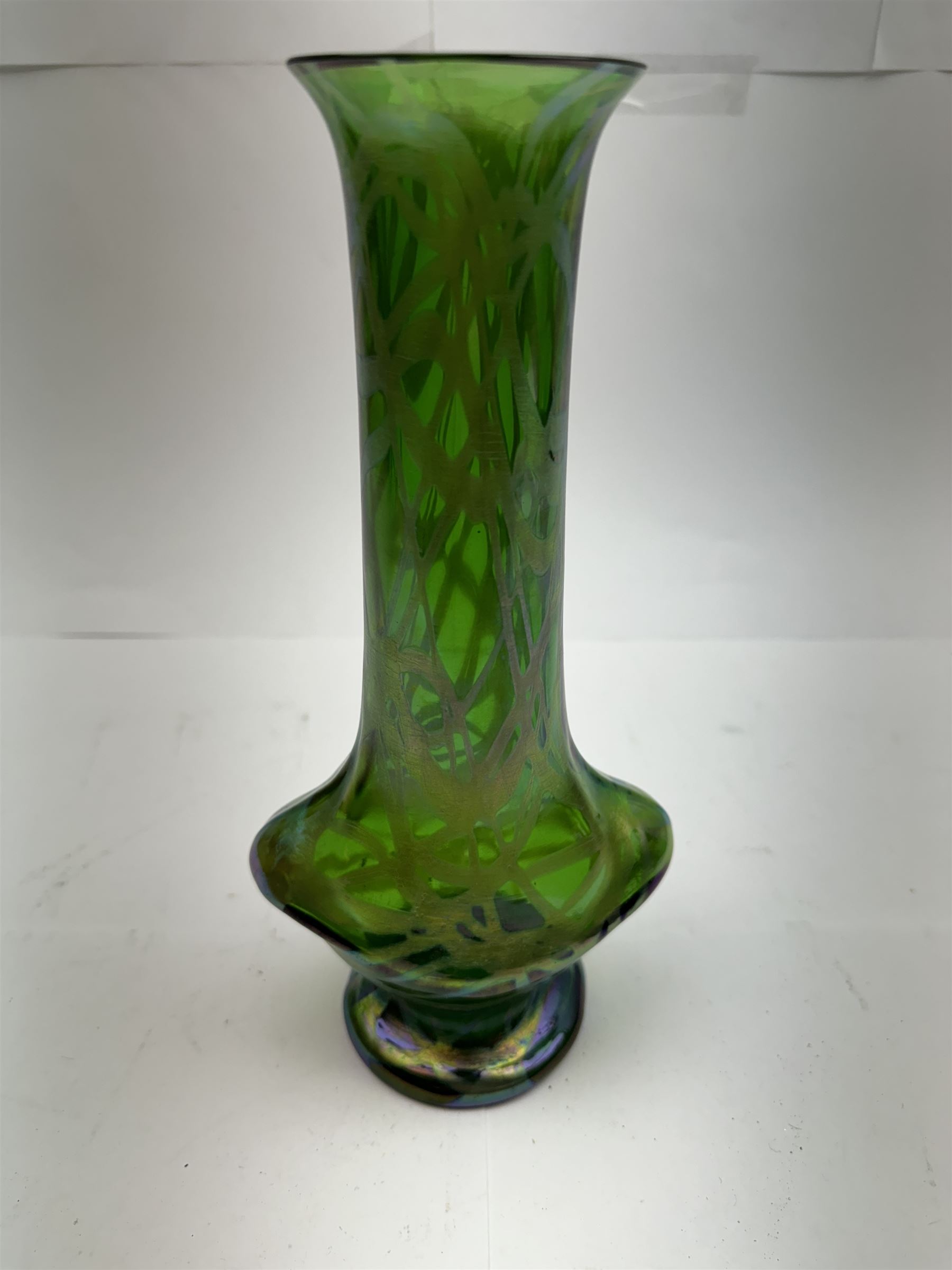 Three Austrian Art Nouveau green iridescent glass vases, to include two Pallme-Konig examples and a Kralik example, each with threaded vein decoration, tallest H25cm (3)