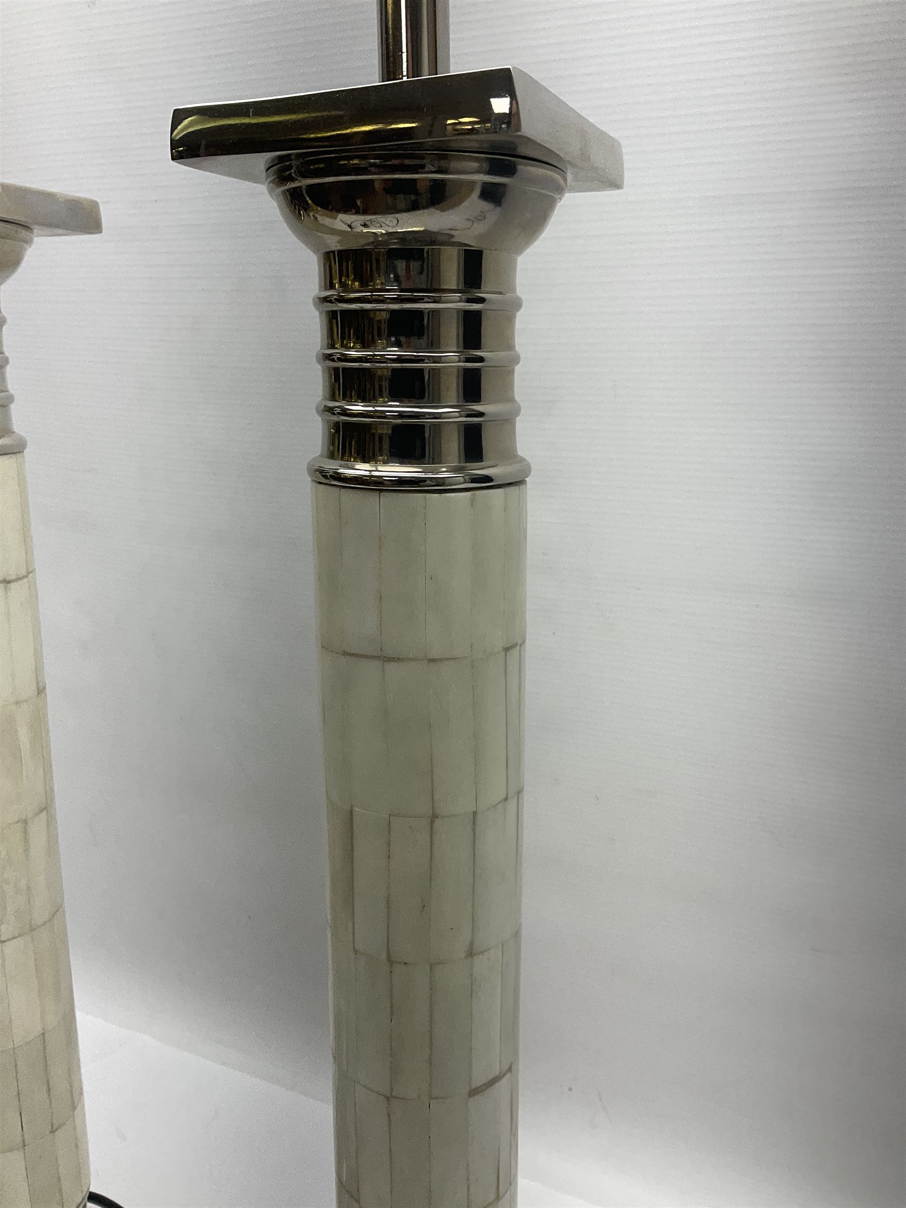 Pair of Parex table lamps, each of columnar form, the column with mosaic design standing on a stepped plinth, H68cm
