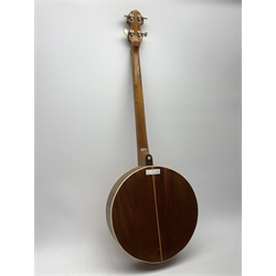 Four-string banjo guitar with mahogany circular back and sides and spruce top, mother-of-pearl inlaid fingerboard and headstock, bears humorous label 'Fender Bedpanjo', L95cm