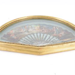 18th century fan, the mother-of-pearl sticks and guard carved, pierced, silvered and gilded, the paper leaf painted with mythological figures within gilt borders, framed and glazed, overall H35cm L55cm

Provenance: From the Estate of the late Dowager Lady St Oswald