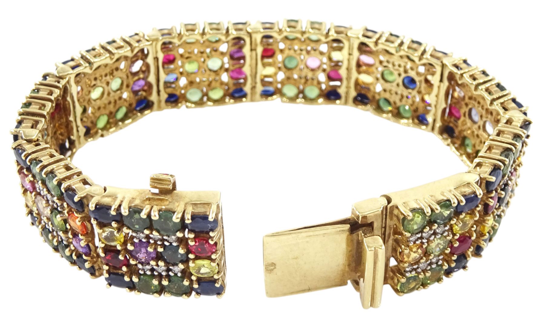 9ct gold sapphire, ruby and diamond bracelet, vari-cut blue fancy coloured sapphires, oval cut rubies and round brilliant cut diamonds, Birmingham 2006