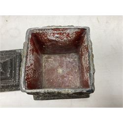 19th century lead tobacco box, the body of square form decorated with panels of courting couples in relief supporting stepped tapering lid with figural male head finial, H18.5cm