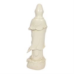 Large Chinese blanc de chine figure of Guanyin, depicting the goddess stood upon a lotus leaf with one hand raised, with potters seal mark to the reverse, H75cm