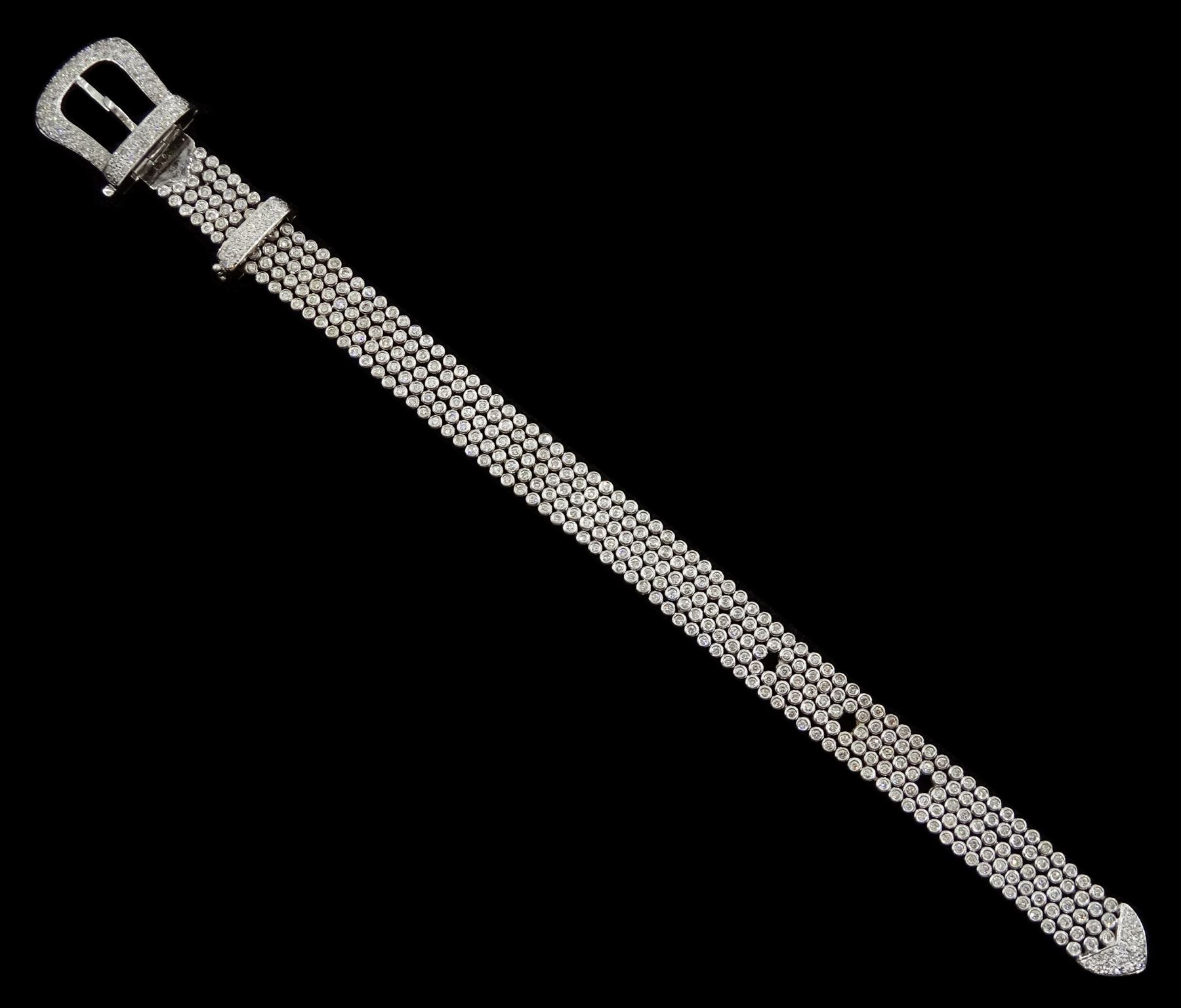 14ct white round brilliant cut diamond belt bracelet, the bracelet with rubover set diamonds, the buckle and clasp with pave set diamonds, stamped 14K, total diamond weight 5.35 carat