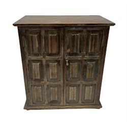 Oak smokers cabinet, the hinged linen fold panelled double doors opening to reveal fitted interior with drawer, H27.5cm L25cm D16cm