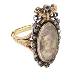 18th / 19th century silver and gold diamond and sapphire portrait ring, set with an oval miniature of a woman wearing a bonnet on ivory, under a glazed panel, surmounted with a 'trophy of love' symbol, modelled as a flaming torch and bow and quiver, set with a single round cut sapphire and rose cut diamond surround, to trifurcated shoulders, on French 18ct gold shank, Eagle hallmark. This lot has been registered for sale under Section 10 of the APHA Ivory Act