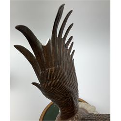 Three Franklin Mint figures, first example On The Prowl, on wooden stand H32cm, L63.5cm, Grizzly, H23cm and American Majesty by Ronald Van Ruyckevelt H37cm, together with five other figures.  