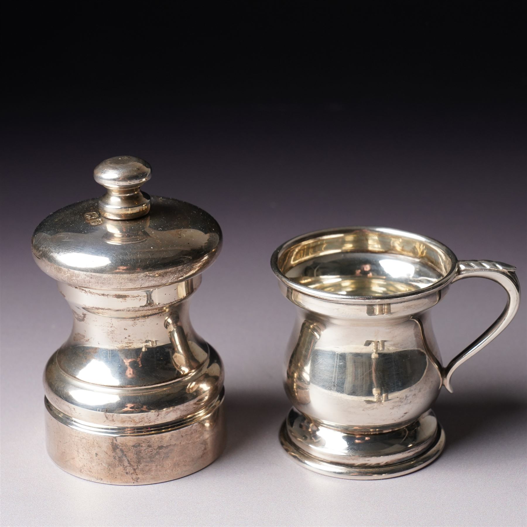 Small silver pepper mill H7cm London 1987,  small silver baluster measure, silver egg cup, two thimbles and a silver note clip