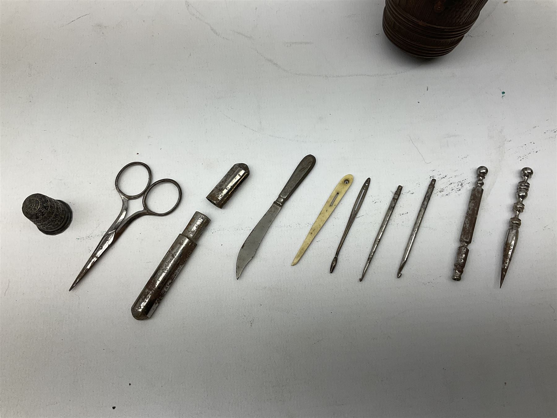 19th century wooden beehive thimble holder with silver bee decoration, black forest style pin cushion and thimble holder, modelled in the form of a standing bear and a wooden cased sewing set with silver thimble, sewing set H10cm