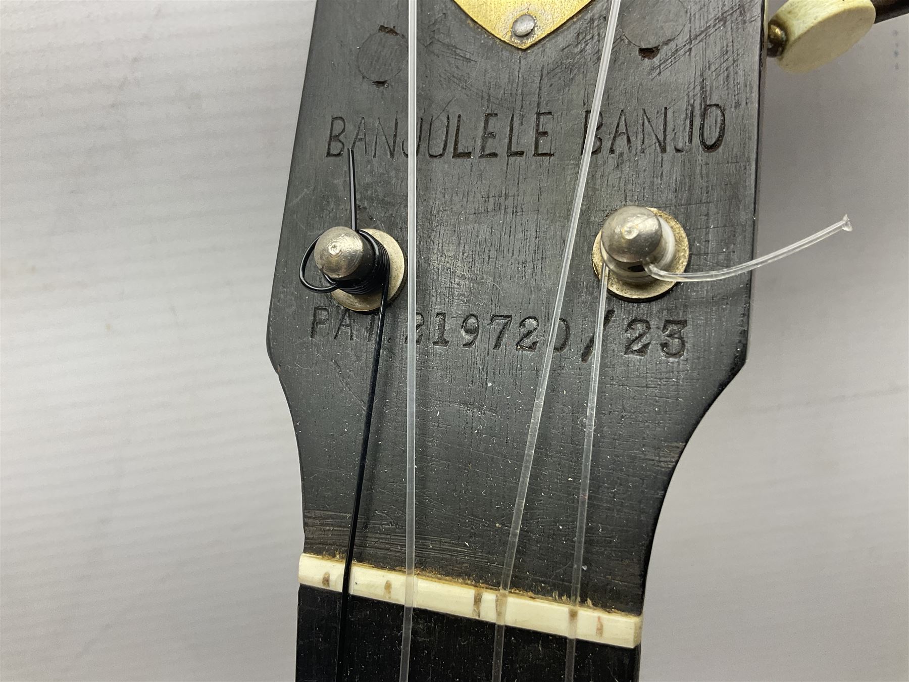 W.D. Keech banjolele pat.219720/23 with etched signature to the back; serial no.A12082 L55cm; and a restored Italian mandolin with segmented lute back; together with three music books