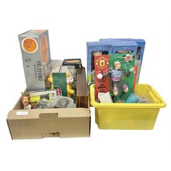 Collection of vintage and later toys and memorabilia to include Merlin’s Football sticker book, boxed child’s electric telephones, Only Fools and Horses money box, four boxed The Promenade Collection dolls etc in two boxes