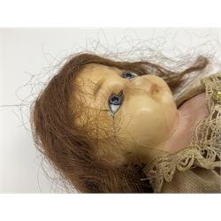 Victorian wax shoulder head doll with applied hair, inset glass eyes and jointed body with composition lower limbs; faded pink dress H35cm