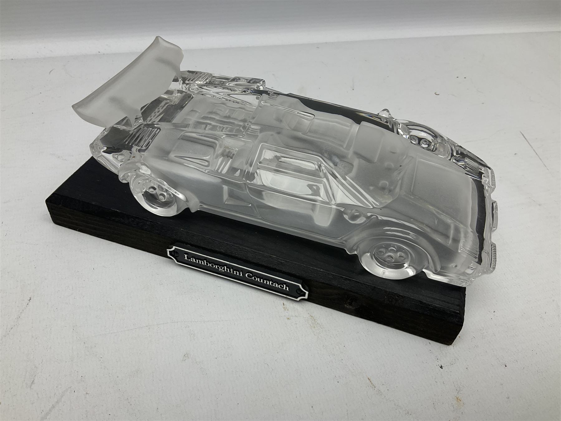 Three Franklin Mint die-cast models comprising 1935 Mercedes 500k Special Roadster, 1938 Jaguar SS-100 and 1907 Rolls Royce The Silver Ghost, together with Hof Bauer glass Lamborghini Countach
model and Bburago Jaguar 1961 'E' type
