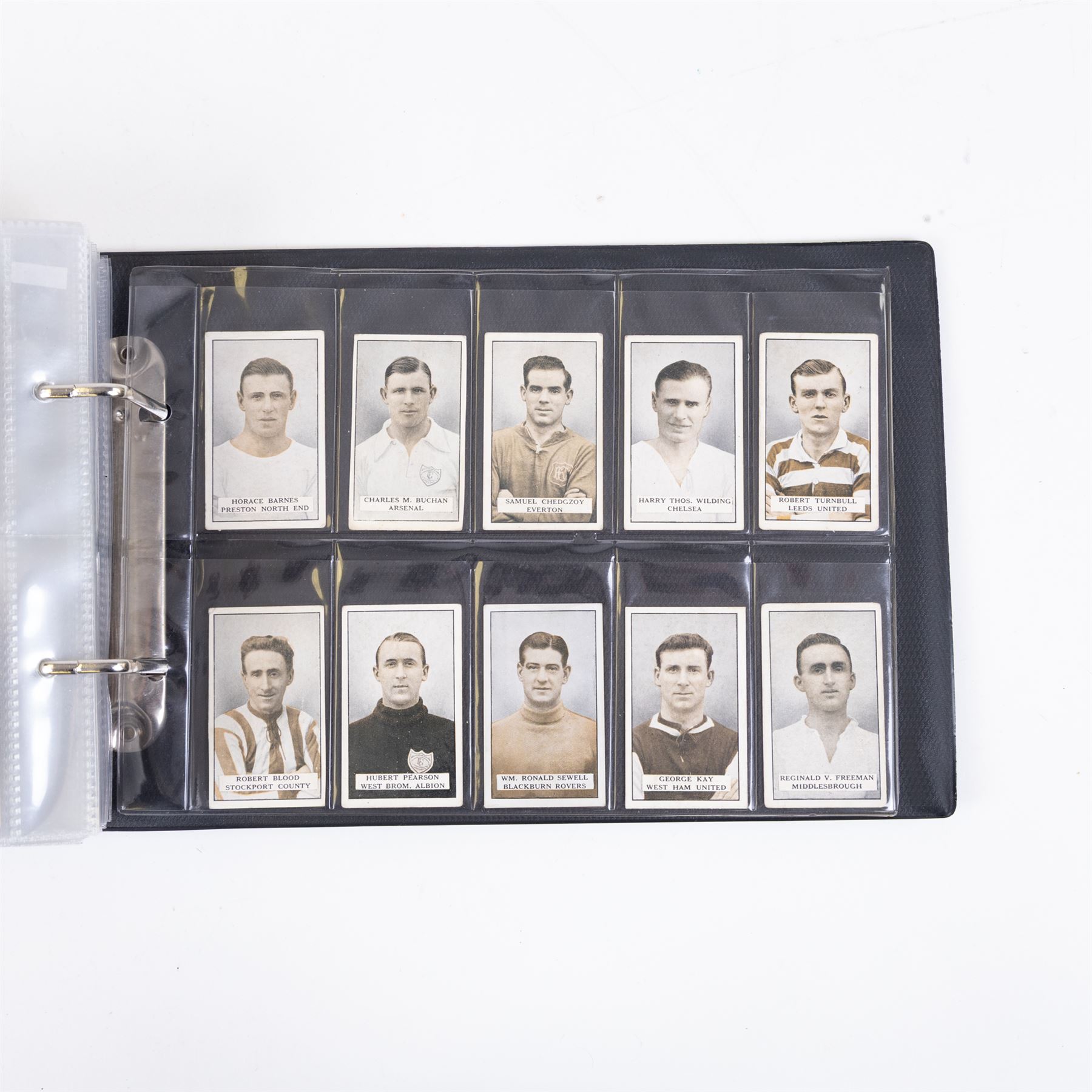 Collection of Edwardian and later Football related trading and cigarette cards, including forty-nine of fifty 1906 Ogden's Football Club Colours, 1922 PALS Footall series, ninety of one hundred 1925 Gallaher Famous Footballers, complete set of forty-four 1926 Ogden's Captains of Association Football Clubs and Colours, complete set of fifty 1927 Players Football Caricatures by MAC,  complete set of fifty 1927 Players Football Caricatures by RIP,  complete set of fifty 1930 Players Association Cup Winners, complete set of 50 1933 Ogdens AFC Nicknames etc, housed in brown cigarette card album