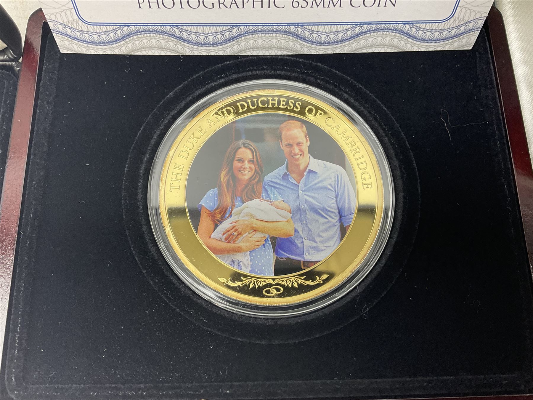 Mostly commemorative coins including The Royal Mint 1997 proof coin collection, Westminster 2013 'The Royal Baby Photographic 65mm' coin, Jubilee Mint 2017 'The Queen Elizabeth II Sapphire Jubilee' five pound coin collection etc