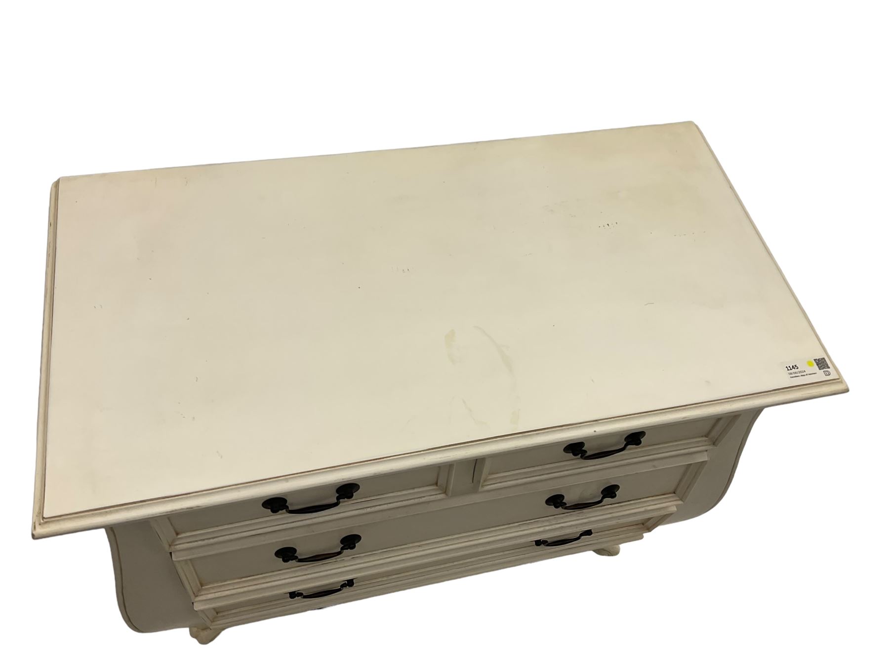 French design bombe shaped chest, moulded rectangular top over two short and three long drawers, on scrolled feet, in cream paint finish 