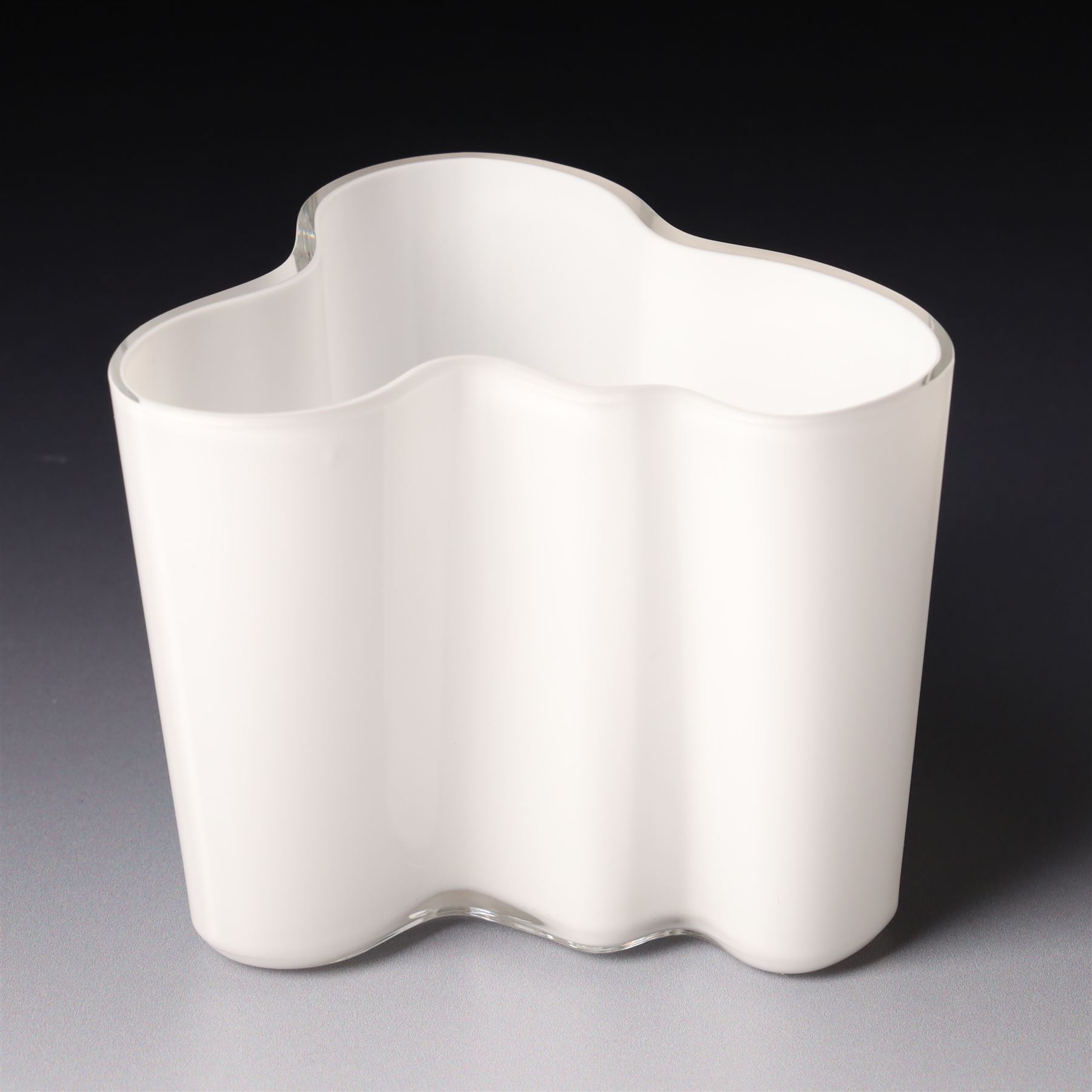 Alvar Aalto (Finnish 1898-1976) for Iittala: Set of three white glass vases, marked Alvar Aalto to base, largest H16cm (3)