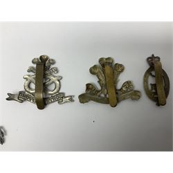 Nineteen Yeomanry metal cap badges including Derbyshire, Northamptonshire, Essex, Glamorgan, Staffordshire, City of London, Surrey, Shropshire, Hertfordshire etc; together with eleven Fusiliers badges including Lancashire, Royal Welch, Northumberland etc (30)