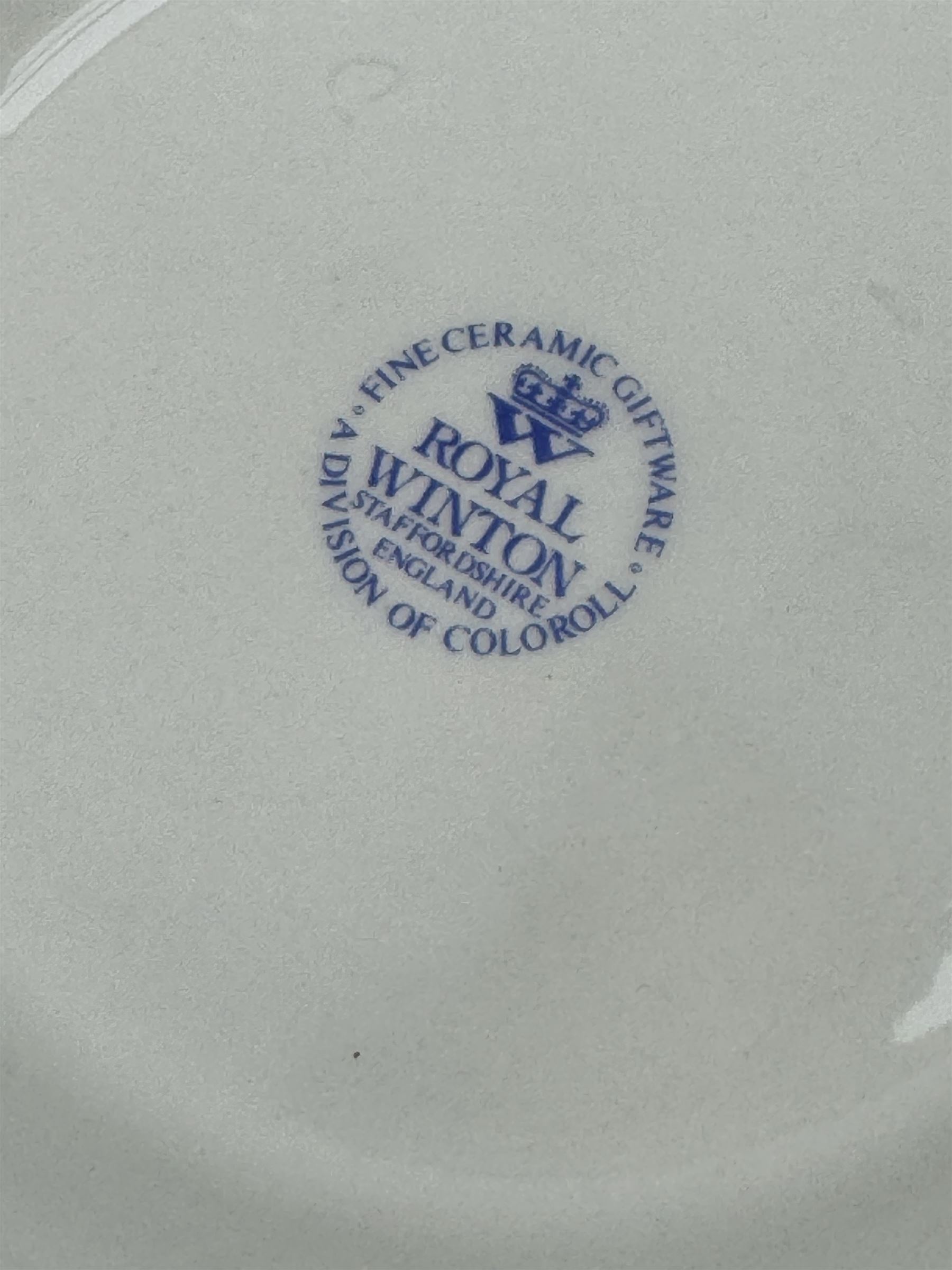 Royal Winton - early 20th century ceramic jardinière on stand, white ground with polychrome floral decoration, flared rim and twin handles, on circular base