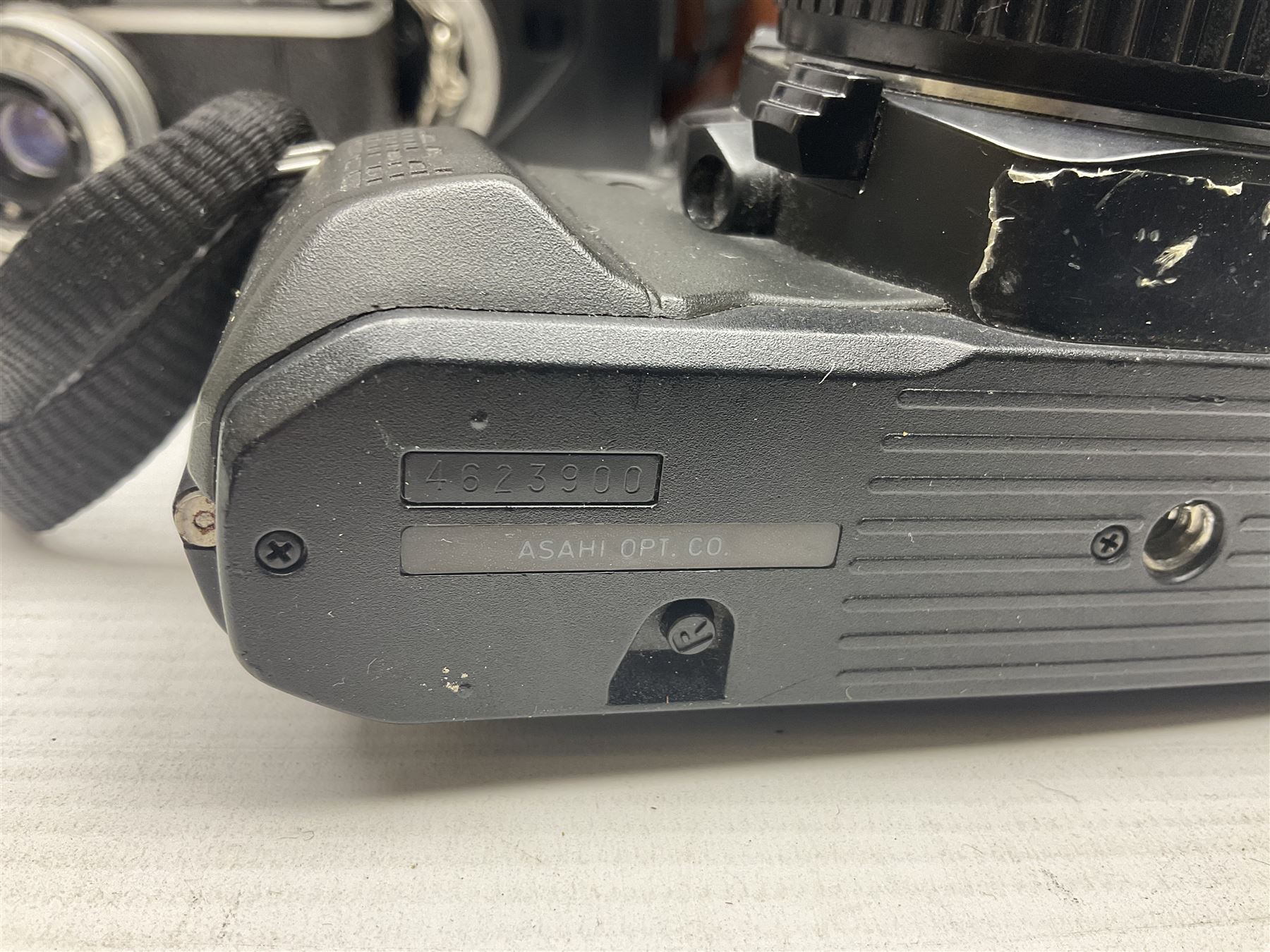 Collection of cameras and lenses, to include Pentax Program A camera body, serial no 123759, with 'Pentax-A zoom 1:3.5-4.5 28-80mm' len, Praktica EE2 camera body with 'Pentacon electric 1.8/50' lens etc, together with a Manfrotto tripod 