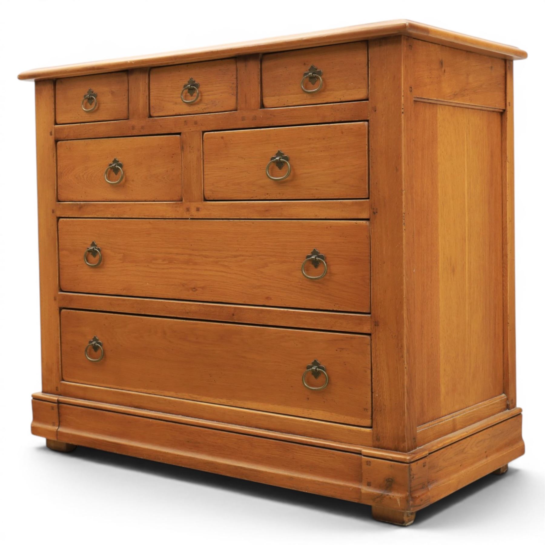 Solid oak chest, fitted with an arrangement of five short and two long drawers