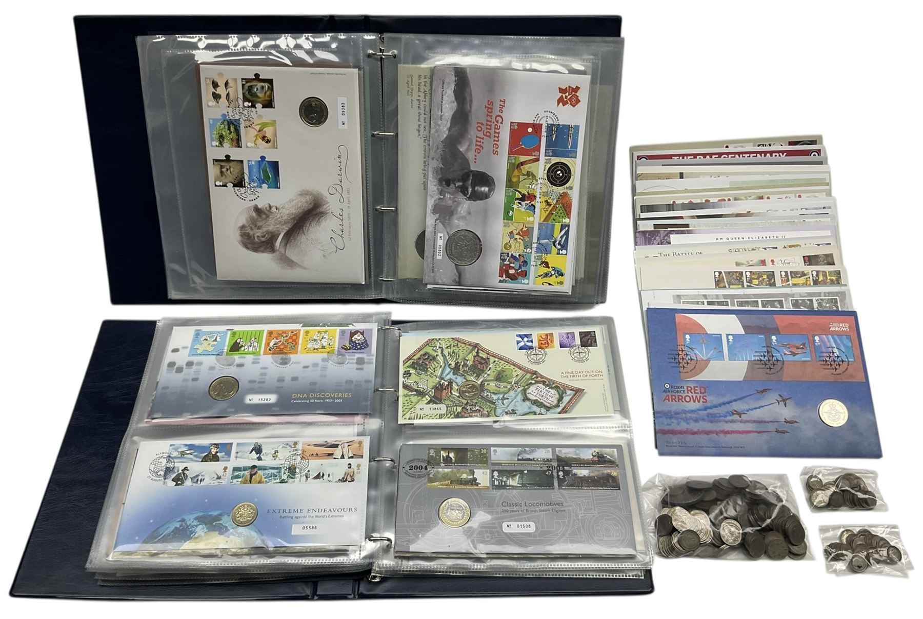 Approximately one hundred and fifteen Royal Mint coin covers, in two ring binder folders and loose, together with approximately 53 grams of Great British pre-1920 and approximately 68 grams of Great British pre-1947 silver threepence coins, and a small quantity of further pre-decimal coins