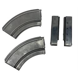Two machine gun magazines, one marked 'II M/117' and two other magazines 