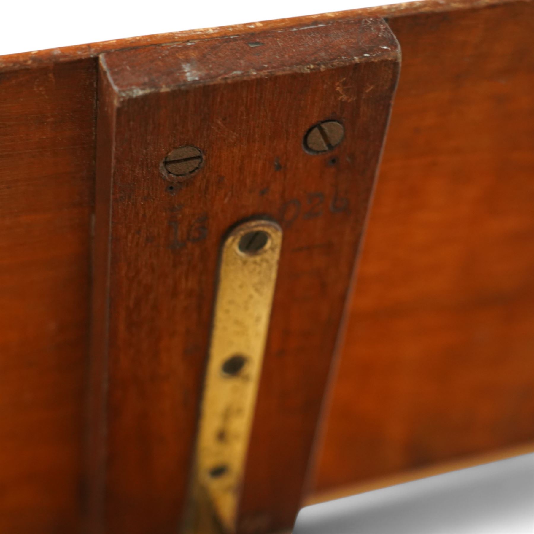 Victorian mahogany and brass adjustable music stand, tilting rest with edge, height adjustment mechanism to central column, supported on cast iron quadriform base