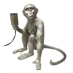 Composite silver effect table lamp, modelled as a seated monkey, H31cm 
