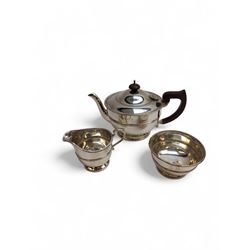1930s silver three piece tea service, comprising teapot, milk jug and sugar bowl, each of circular form with oblique gadrooned rim, the teapot with Bakelite handle and finial, hallmarked Mappin & Webb Ltd, Birmingham 1931, teapot H14.5cm