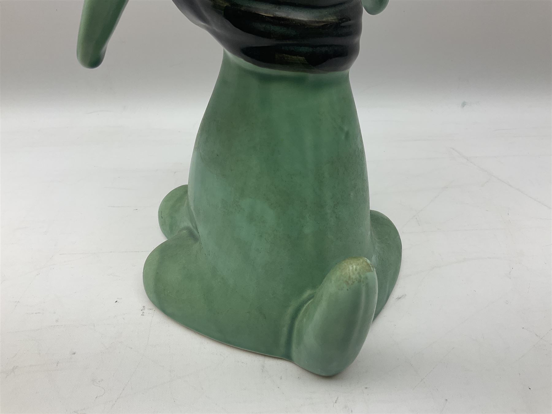 Sylvac 'toothache' dog in the green colourway, no 2451, with impressed beneath, H28.5cm