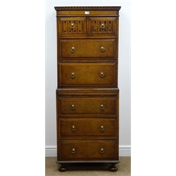  Early 20th century oak chest on chest, dentil cornice, two short carved drawers above five bur fronted graduating drawers with centre slide, turned supports, W63cm, H161cm, D46cm  