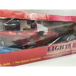 PMS Lightning 1:8 scale remote control racing car; Soma Sonic Man battery operated electronic sounds and light action figure; and CGL Galaxy Invader 10000 computer space battle game; all boxed (3)
