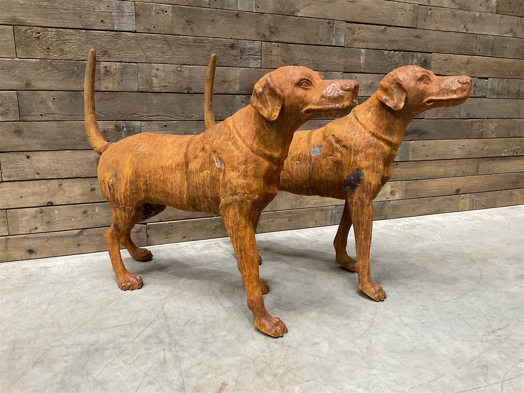 Pair of life-size heavy cast iron garden Hunting dogs