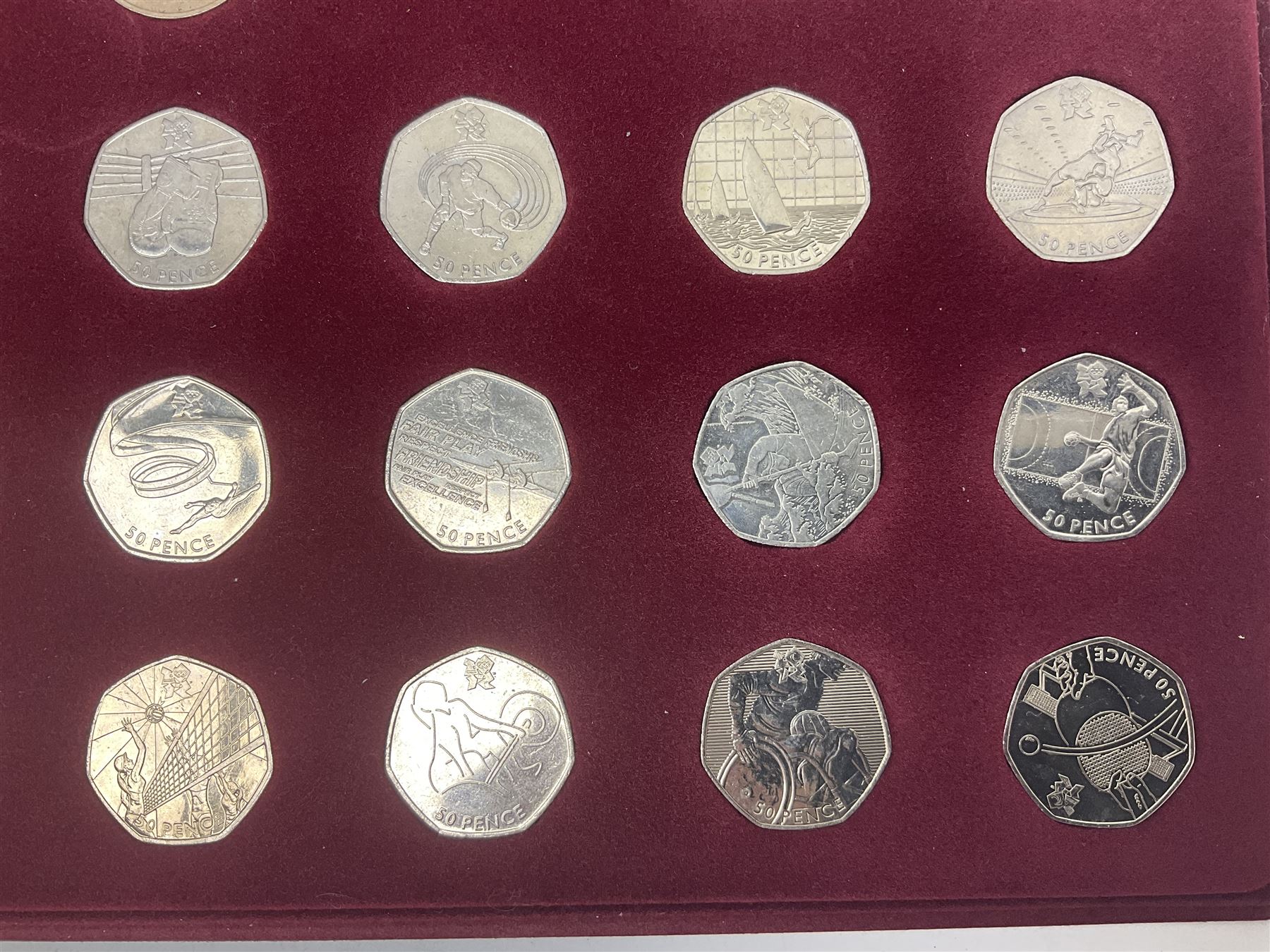 Queen Elizabeth II United Kingdom London 2012 Olympic commemorative fifty pence collection comprising twenty-nine coins and completer medallion, housed in unofficial display case