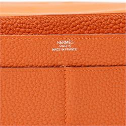 Hermès - Dogon Duo wallet, orange Togo leather, with palladium-plated Clou de Selle fastening, detachable zipped coin purse and fitted interior, stamped 10N H, with original box