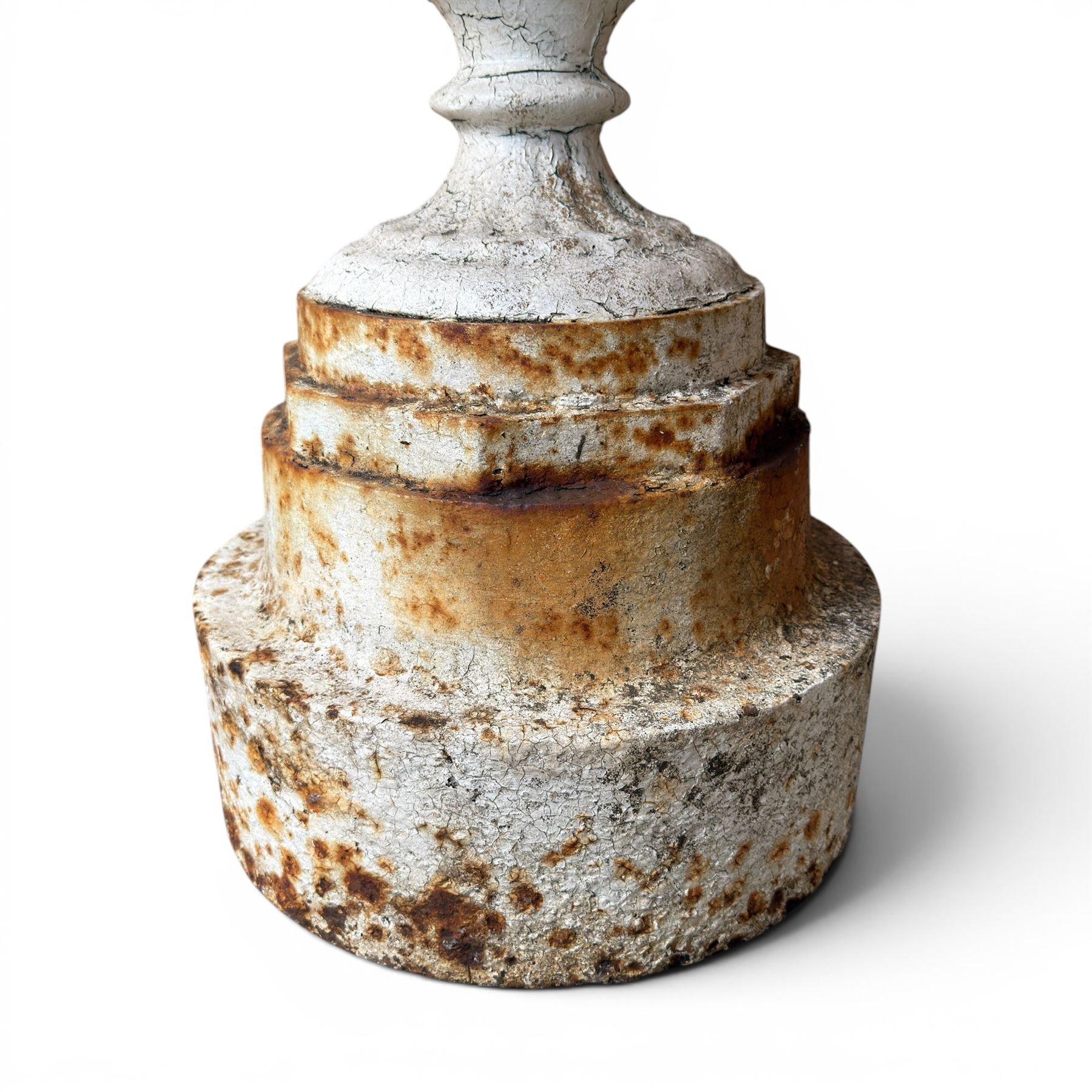 Victorian cast iron garden urn, egg and dart rim with shallow bowl, raised on stepped circular pedestal, finished in weathered white paint 