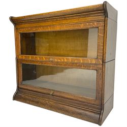 Globe Wernicke design - early 20th century oak two sectional library bookcase, enclosed by hinged and sliding glazed doors