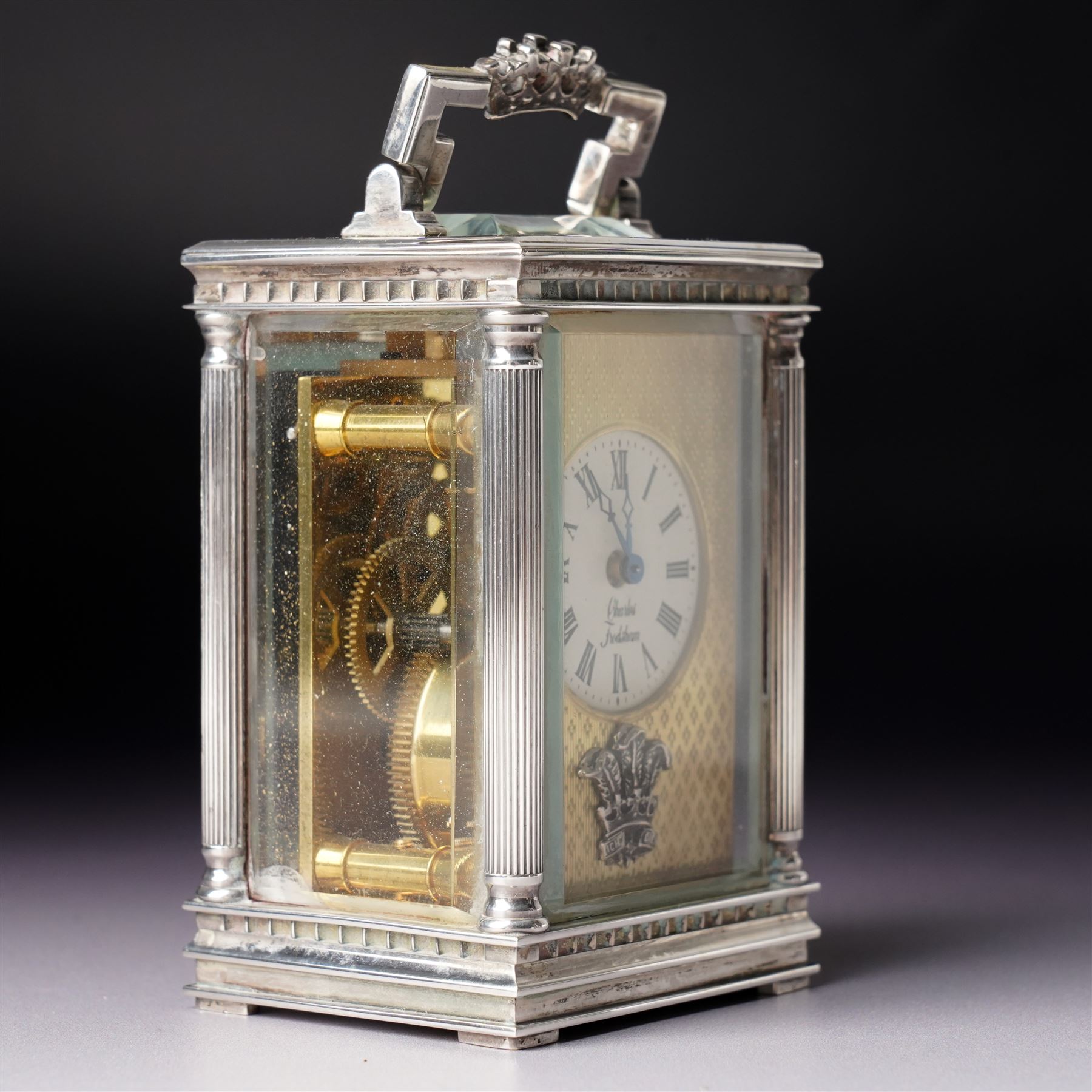Chas Frodsham -  Miniature carriage clock with platform lever escapement commemorating the marriage of Prince Charles and Lady Diana Spencer, the white dial with an engine turned gilt surround and fleur de lis in silver case with fluted columns and bevelled glass panels H10cm  No.43/1000 London 1981 with key