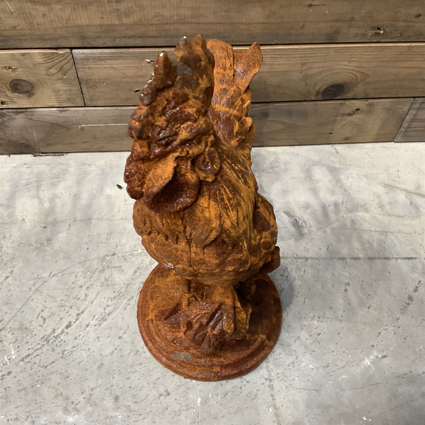 Small cast iron cockerell, on circular base