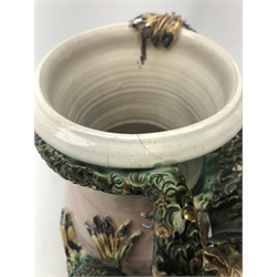  Studio pottery vase with raised entwined dragon decoration amongst foliage, impressed seal S.M, H32cm  