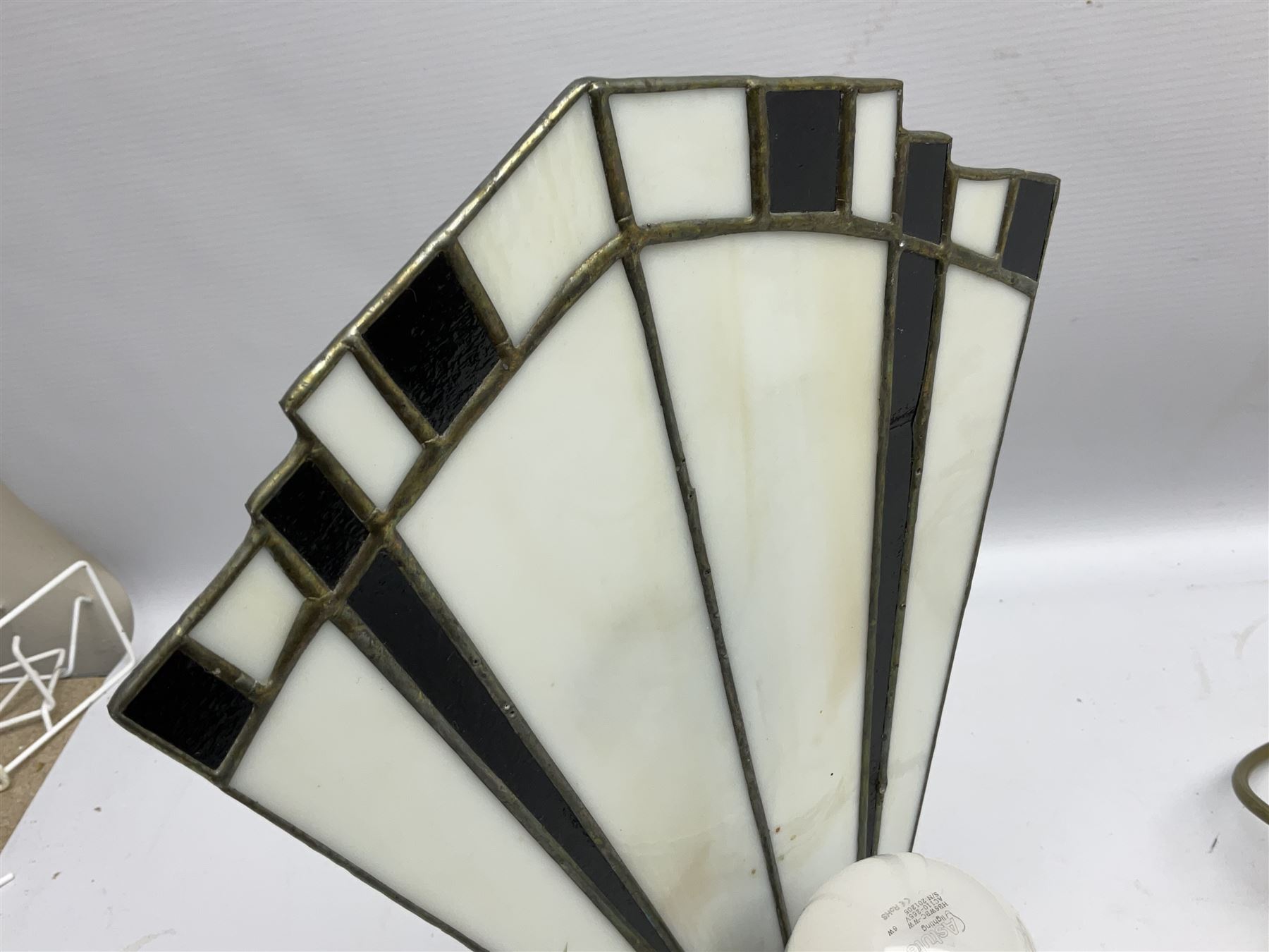 Art Deco style table lamp, modelled in the form of a bronzed female figure before a leaded glass fan shaped shade, H38cm