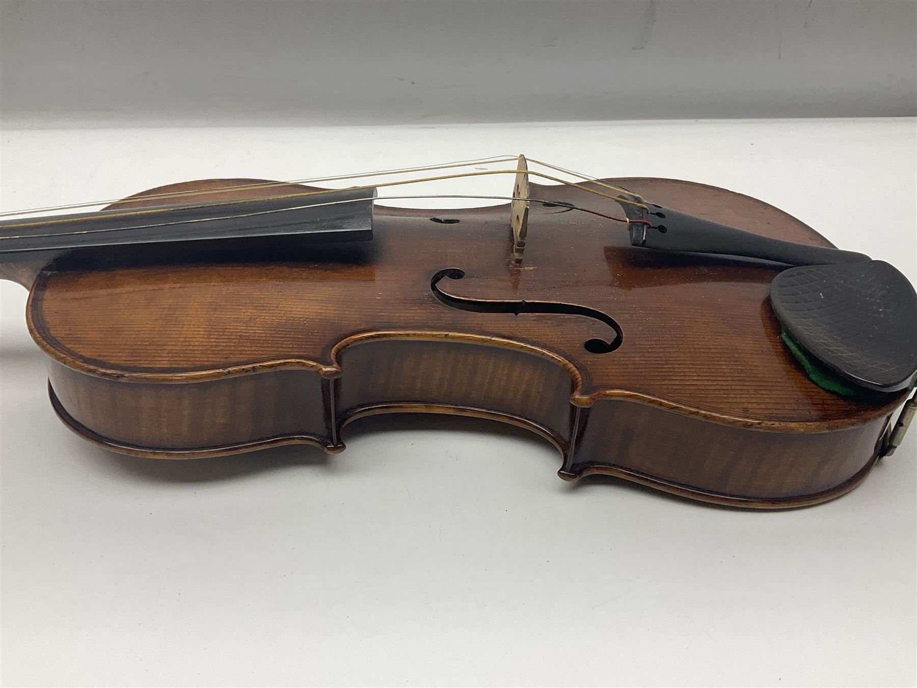 German trade violin c1900 with 35.5cm two-piece maple back and spruce top; bears label 'Made in Germany Apollo Class 6 No.2132' L59cm; in carrying case with two bows