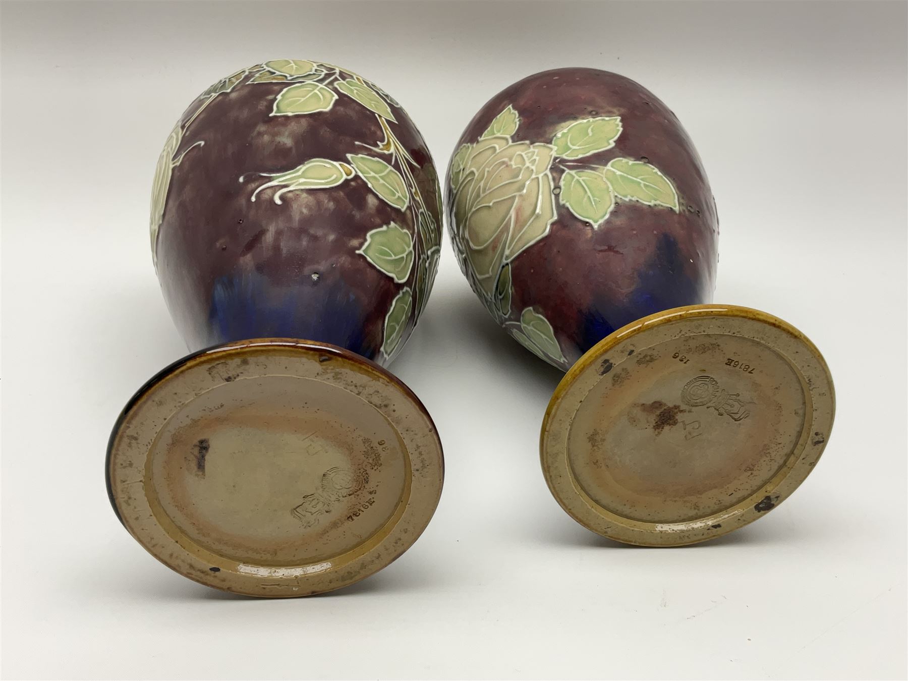 A pair of early 20th century Royal Doulton stoneware vases, of baluster