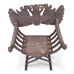 Anglo-Indian bone inlaid hardwood Savonarola chair, the pierced back finely carved with opposing peacocks amongst scrolling foliage, the seat, arms, and X-frame supports. This item has been registered for sale under section 10 of the APHA Ivory Act Reference QWLLGKZM